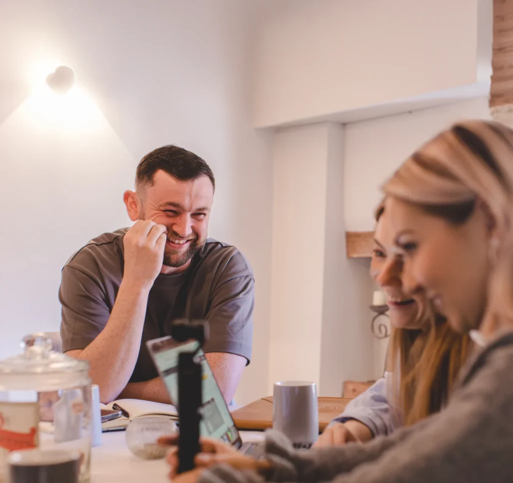 Peach Estate Agents team discussing ideas.